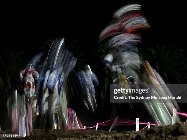 Supercross, a blur of motion as competitors nazigate the undulating terrain during competition at the Supercross masters Grand Final held at a packed...