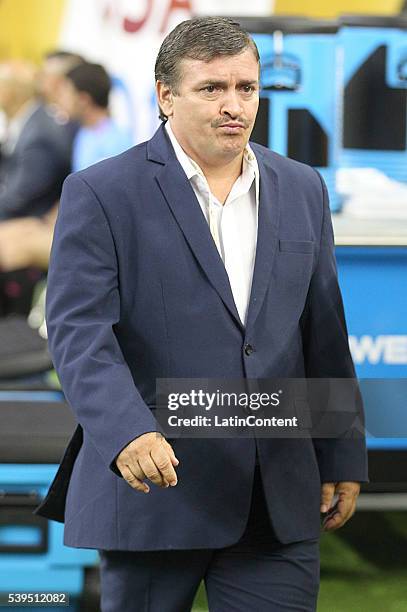 Oscar Ramirez coach of Costa Rica walks the pitch before playing against Colombia in group A match between Colombia and Costa Rica at NRG Stadium as...