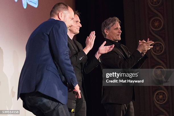 Festival director and chief curator Carl Spence, Director Matt Ross and actor Viggo Mortensen speak on stage after the Seattle International Film...