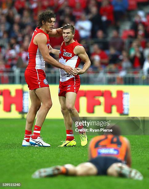 Kieren Jack and Kurt Tippett of the Swans celebrate a goal during the round 12 AFL match between the Greater Western Sydney Giants and the Sydney...