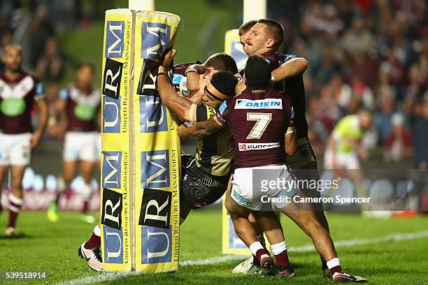 Sitaleki Akauola of the Panthers is held up in goal during the round 14 NRL match between the Manly Sea Eagles and the Penrith Panthers at Brookvale...