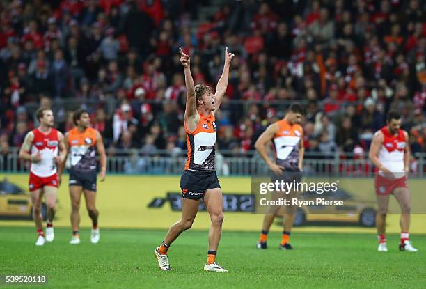 Lachie Whitfield of the Giants celebrates a goal during the round 12 AFL match between the Greater Western Sydney Giants and the Sydney Swans at...