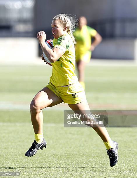 Emma Tonegato of Australia runs with the ball during the match against the United States at Fifth Third Bank Stadium on April 9, 2016 in Kennesaw,...