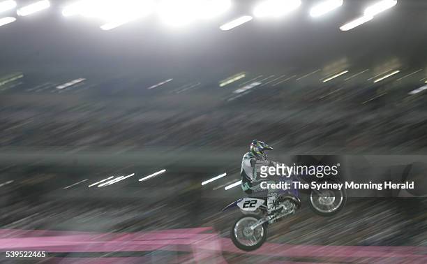 Supercross, a blur of motion as competitors nazigate the undulating terrain during competition at the Supercross masters Grand Final held at a packed...