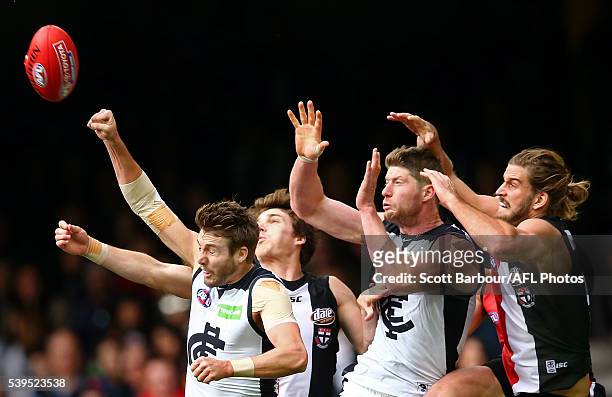 Dale Thomas of the Blues, Sam Rowe of the Blues and Josh Bruce of the Saints compete for the ball during the round 12 AFL match between the St Kilda...