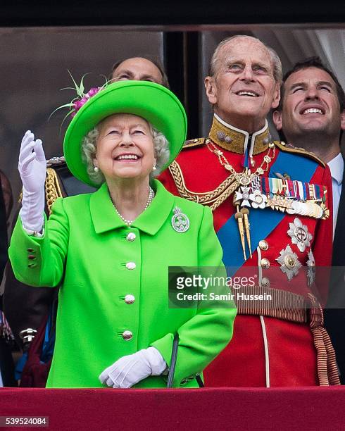 Queen Elizabeth II and Prince Philip, Duke of Edinburgh stand on the balcony during the Trooping the Colour, this year marking the Queen's official...