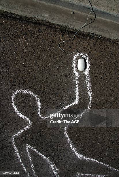 Chalk Outline of a man and a computer mouse positioned over the hand, 14 February 2003. THE AGE Picutre by CATHRYN TREMAIN