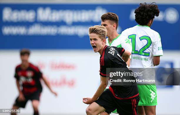 Jan Boller of Leverkusen celebrates after scoring his team's third goal infront of Abdallah El-Haibi of Wolfsburg during the U17 German Championship...