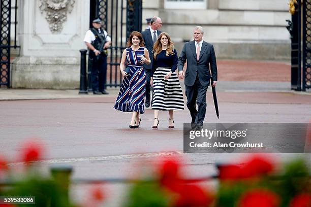 Princess Eugenie of York, Princess Beatrice of York and Prince Andrew, Duke of York walk about during "The Patron's Lunch" celebrations for The...