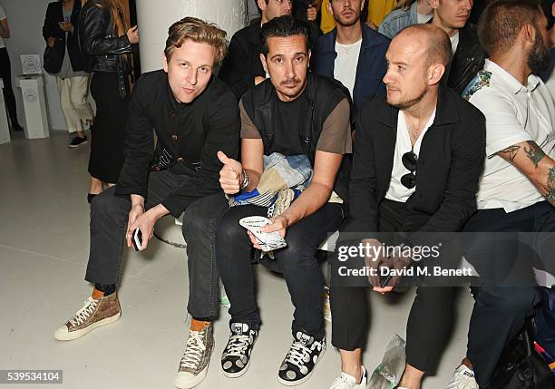 Bosse Myhr, Sebastian Manes and guest attend the Christopher Raeburn show during The London Collections Men SS17 at BFC Show Space on June 12, 2016...