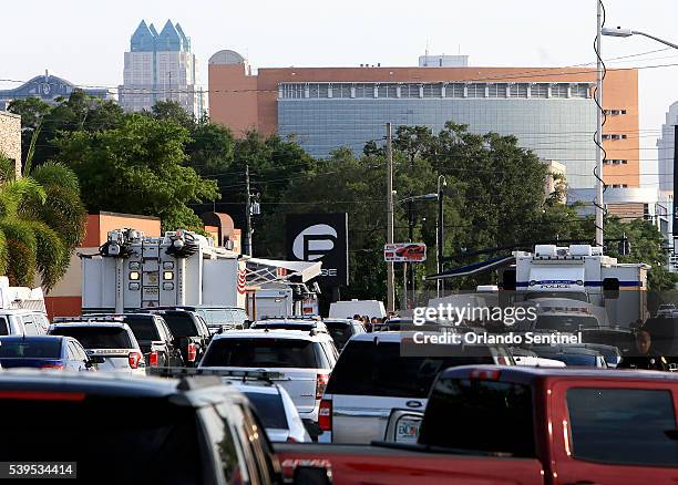 Orange Avenue continues to be closed south of downtown Orlando, Fla., as law enforcement officials investigate a mass-casualty shooting at the Pulse...