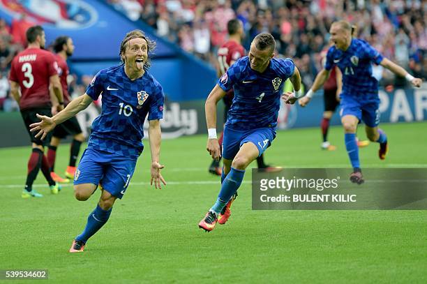 Croatia's midfielder Luka Modric celebrates their first goal during the Euro 2016 group D football match between Turkey and Croatia at Parc des...