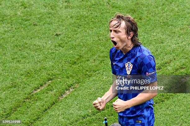 Croatia's midfielder Luka Modric celebrate the team's first goal during the Euro 2016 group D football match between Turkey and Croatia at Parc des...