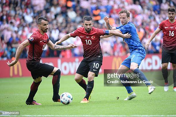 Arda Turan of Turkey and Ivan Rakitic of Croatia during Group-D preliminary round between Turkey and Croatia at Parc des Princes on June 12, 2016 in...