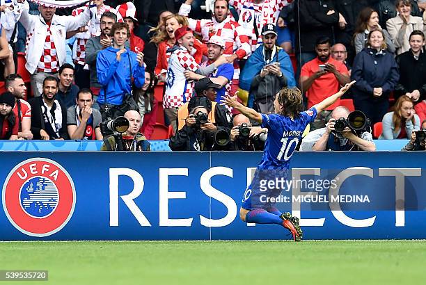 Croatia's midfielder Luka Modric celebrates after scoring his team's first goal during the Euro 2016 group D football match between Turkey and...