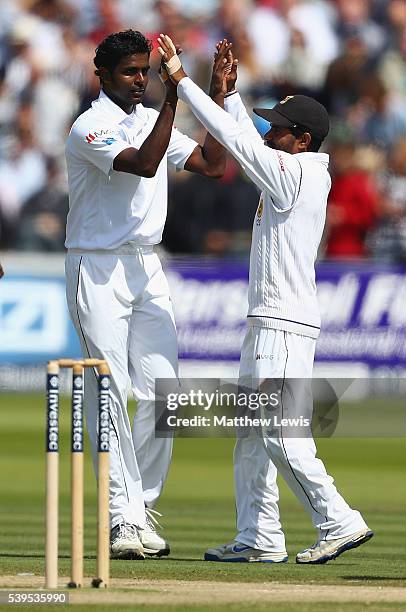 Shaminda Eranga of Sri Lanka is congratulated on bowling Steven Finn of England for LBW during day four of the 3rd Investec Test match between...