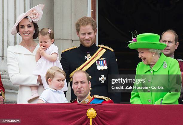 Catherine, Duchess of Cambridge, Princess Charlotte, Prince George, Prince William, Duke of Cambridge, Prince Harry and Queen Elizabeth II stand on...