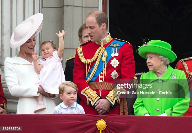 Catherine, Duchess of Cambridge, Princess Charlotte, Prince George, Prince William, Duke of Cambridge and Queen Elizabeth II stand on the balcony of...