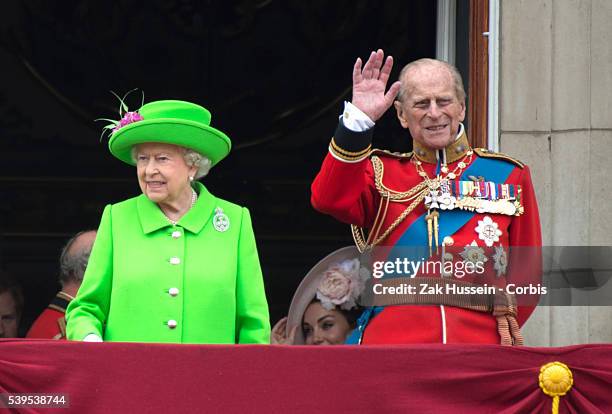 Queen Elizabeth II and Prince Philip, Duke of Edinburgh stand on the balcony of Buckingham Palace during the Trooping the Colour, this year marking...