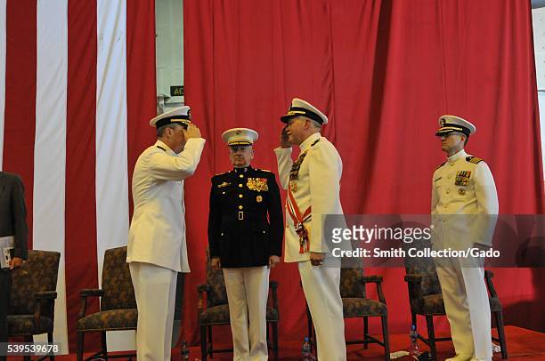 Vice Admiral John Miller, left, relieves Vice Admiral Mark Fox as commander of US, Khalifa Bin Salman Port, Bahrain, 2012. Image courtesy Mass...