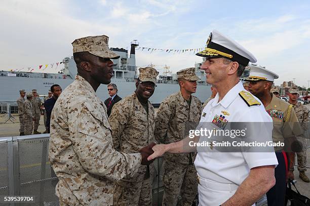 Chief of Naval Operations CNO Admiral Jonathan Greenert shakes hands and meets with Marines at the USO New York City Fleet Week block party, New...