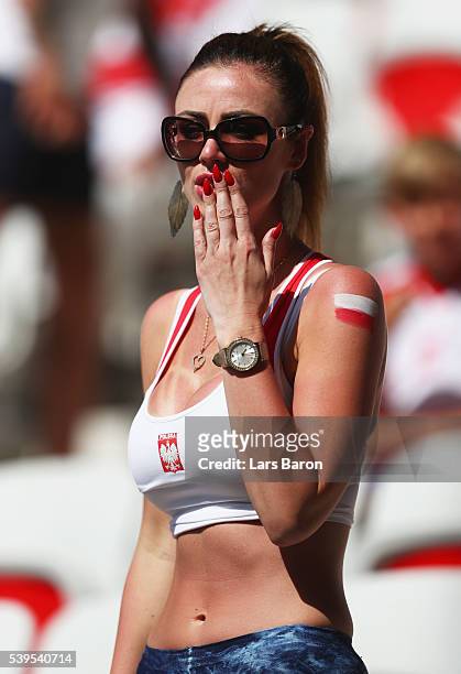 Poland fan blows a kiss prior to the UEFA EURO 2016 Group C match between Poland and Northern Ireland at Allianz Riviera Stadium on June 12, 2016 in...