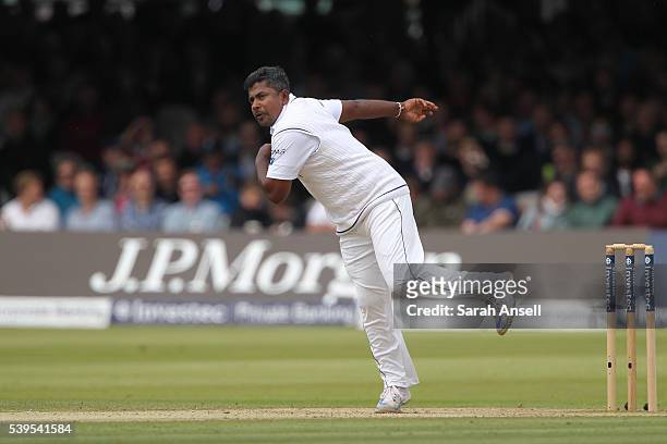 Sri Lanka's Rangana Herath bowls during day four of the 3rd Investec Test match between England and Sri Lanka at Lord's Cricket Ground on June 12,...
