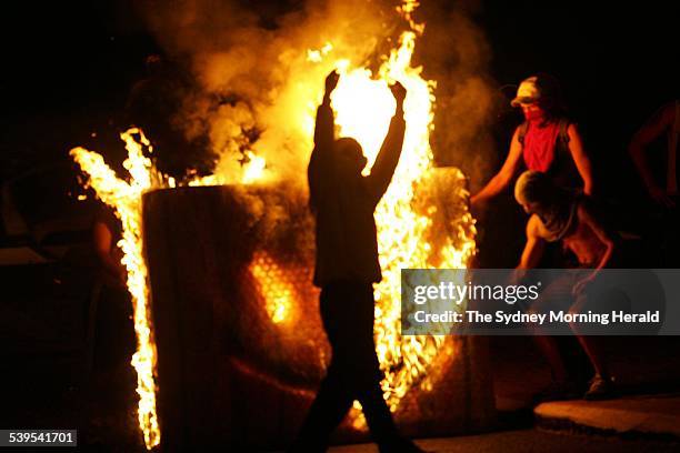 Youths burn a mattress in Macquarie fields during the riots, 28 February 2005. SMH Picture by NICK MOIR