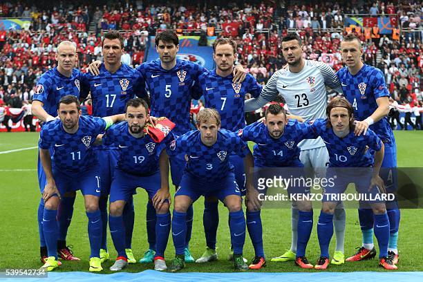 Croatia team members pose for a group photograph from bottom left: Croatia's defender Darijo Srna, midfielder Milan Badelj, defender Ivan Strinic,...