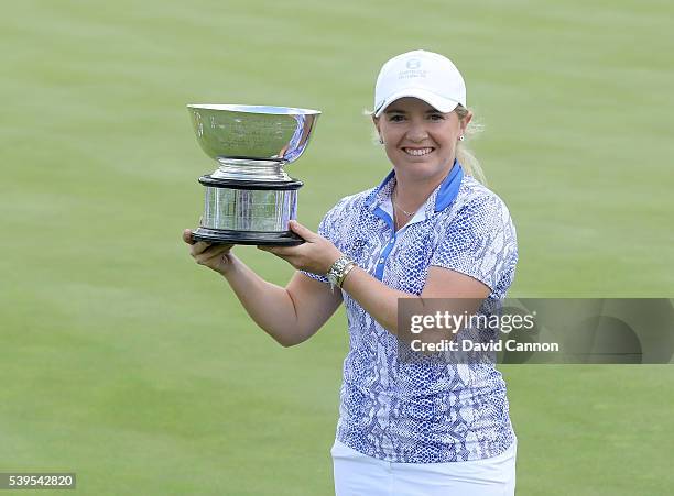 Bronte Law of England and the Great Britain and Ireland team holds the Curtis Cup after her undefeated match record of 5 wins had help secure a 11.5...