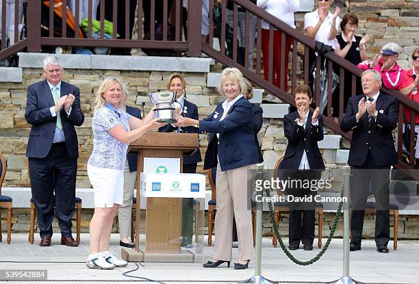Elaine Farquharson-Black the Great Britain and Ireland team captain is presented with the Curtis Cup by Diane Bailey MBE the President of the Ladies...