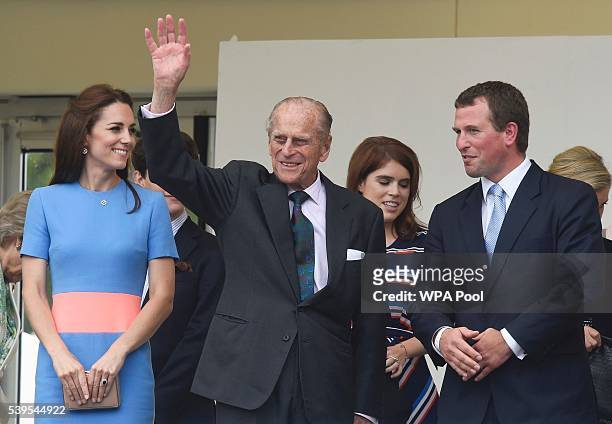 Catherine, Duchess of Cambridge and Peter Phillips look on as Prince Philip, Duke of Edinburgh waves to guests attending "The Patron's Lunch"...