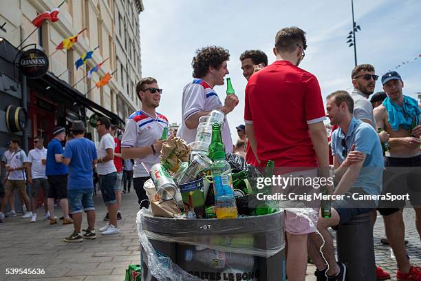 Rubbish bins overflow with beer can and bottles as England fans enjoy the pre-match build up in Marseille old town prior to the UEFA Euro 2016 Group...