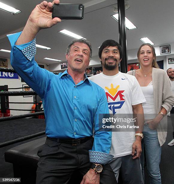 April 18 Hollywood,Calif. --- Actor Sylvester Stallone and his daughter Sophia Rose take a selfie with boxer Manny Pacquiao during a visit to the...