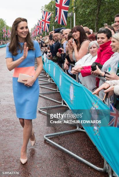 Britain's Catherine, Duchess of Cambridge meets guests at the Patron's Lunch, a special street party outside Buckingham Palace in London on June 12...