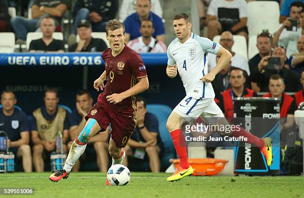 Roman Neustadter of Russia and James Milner of England in action during the UEFA Euro 2016 Group B match between England and Russia at Stade...