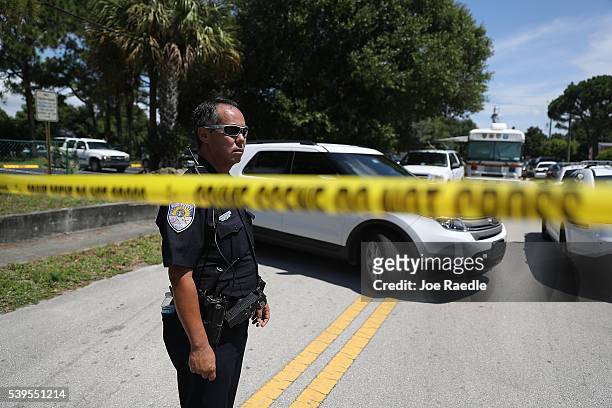 Police tape marks off the entrance to the apartment building where shooting suspect Omar Mateen is believed to have lived on June 12, 2016 in Fort...