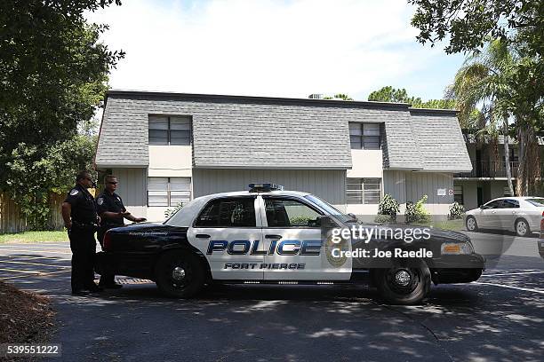 Police block the entrance to the apartment building where shooting suspect Omar Mateen is believed to have lived on June 12, 2016 in Fort Pierce,...