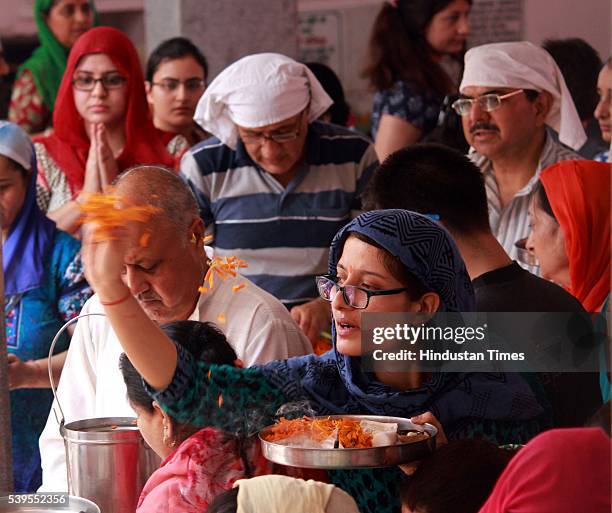 Kashmiri migrant devotees offer prayers during the annual Hindu festival at the Kheer Bhawani Temple, on June 12 in Jammu, India. Around 13,000...