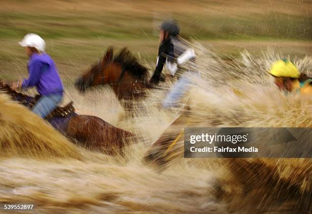 Lancefield Mountain Races. Competitors hit the water course in the 3.7km Ladies Race 5th March 2005. AGE NEWS Picture by NICOLE EMANUEL