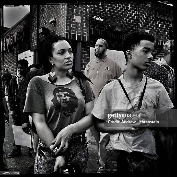 Mother and son prepare to march in a demonstration to protest the death of Freddie Gray, a local man who died while in police custody.