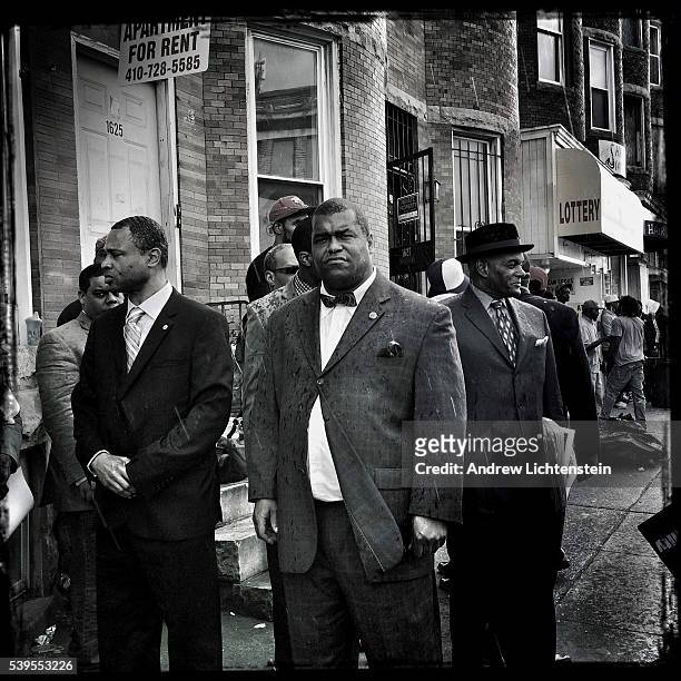 Nation of Islam members gather on North Avenue in Baltimore to march in a demonstration in response to the death of Freddie Gray, a local man who...