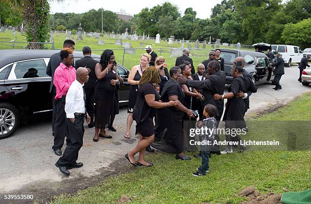 Close friends and family attend the burial service for Ethel Lance, one of the nine parishioners killed by a racist gunman at the historical Emanuel...