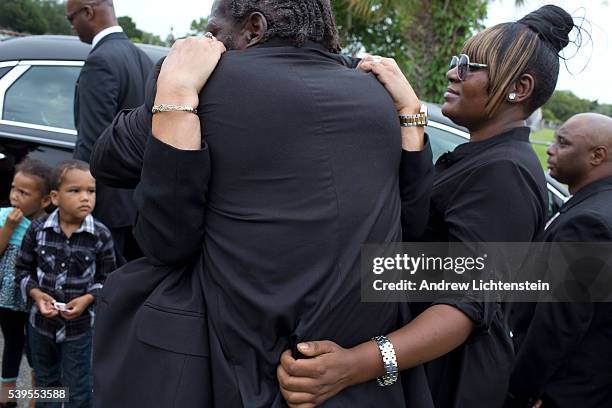 Close friends and family attend the burial service for Ethel Lance, one of the nine parishioners killed by a racist gunman at the historical Emanuel...