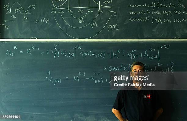 Professor Stephen Clarke is pictured with a formula he has written to win footy tipping comps. Picture taken at Swinburne Uni in Melbourne. 15 April...