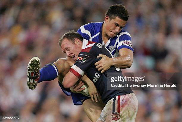 Sonny Bill Williams smashes Craig Fitzgibbon at Telstra Stadium during the Grand Final between The Sydney Roosters and Canterbury Bulldogs, 3 October...