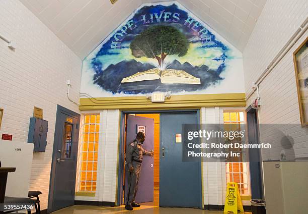 Male guard opens door of chapel inside the maximum security prison near Houston, Texas