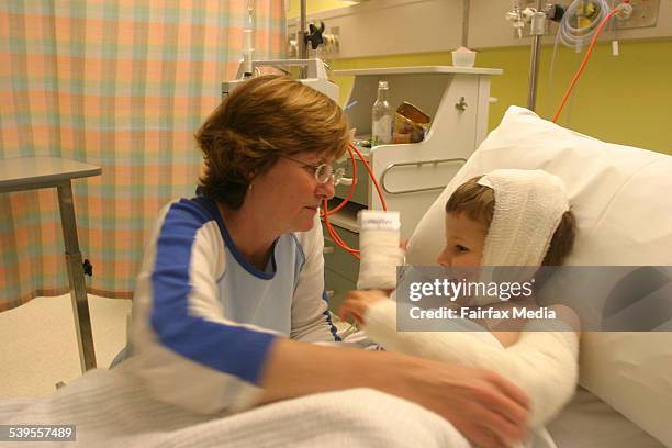 Jordan Wisby in St George Hospital, with father Stephen and mother Morag, by his side, following a savage attack by an American pitbull dog, 30 April...