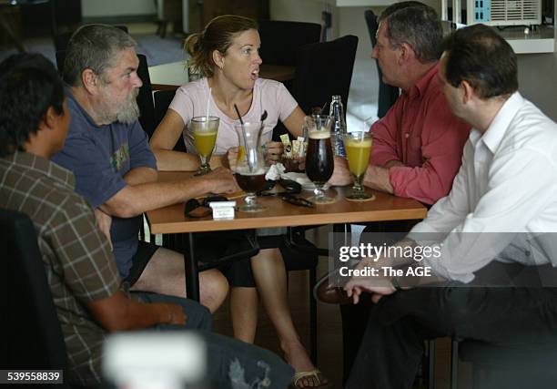 From left, Michael Corby and his daughter Mercedes Corby meet with Australian QC Mark Trowell and his associate Phillip Laskaris in a cafe in Bali,...