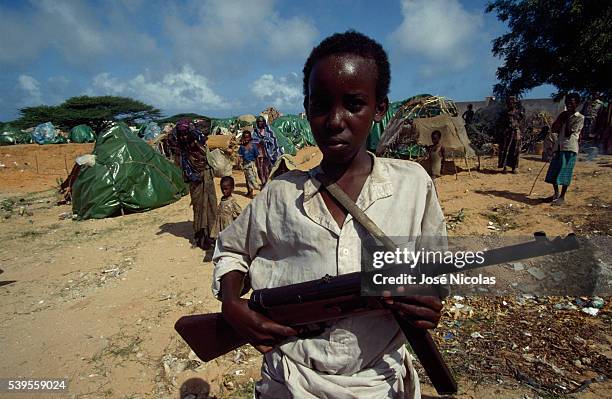 Child soldier in Somalia. Forced workers, sex slaves, soldiers despite themselves, aged 5 to 14, these children do not live childhoods, but hell.